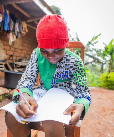 An African child does homework in the village, education in Cameroon An African child does homework in the village, education in Cameroon
